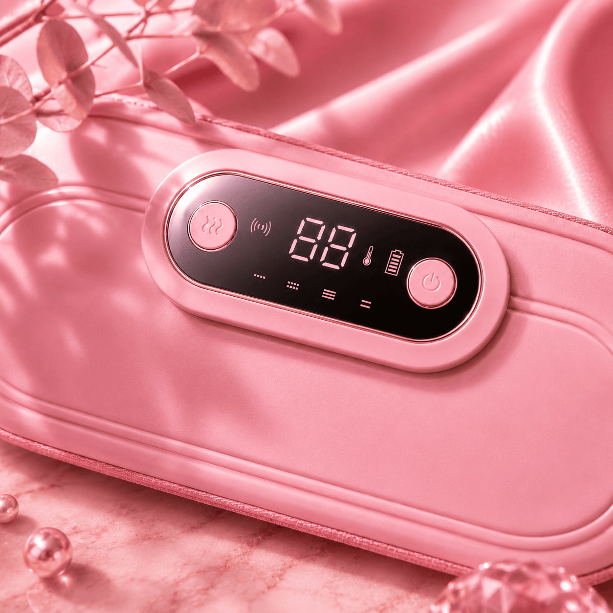 Pink massage device with digital display on a soft pink background